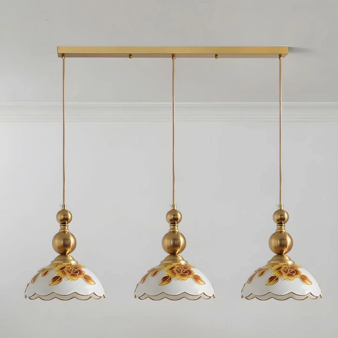 3-head linear gold pendant light with hand-painted floral shades in classic dining space