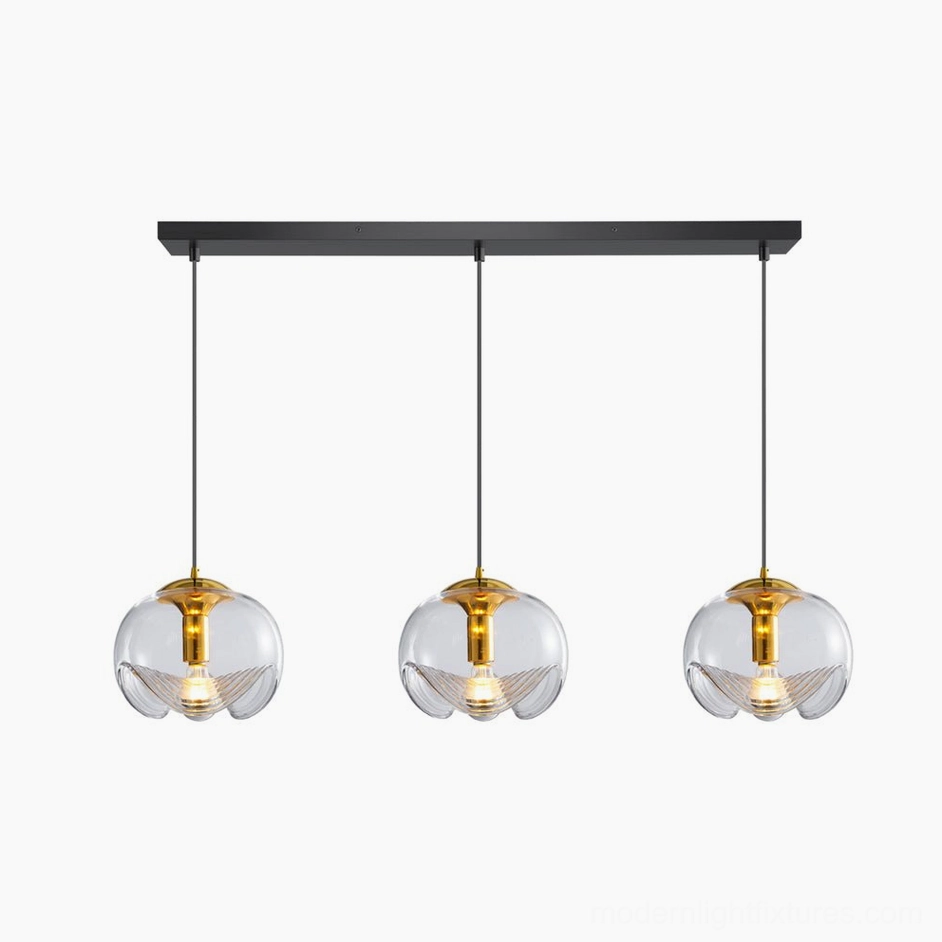 Three-head left configuration modern pendant lights with clear glass shades, 60cm span dining installation showing contemporary design