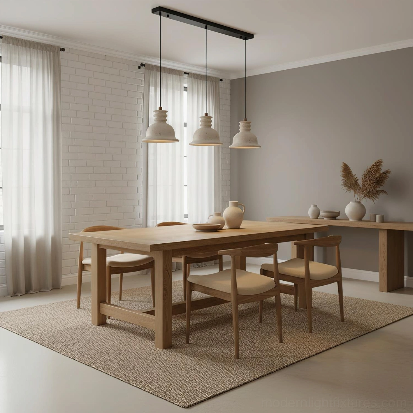 3-light travertine pendant chandelier installed in modern dining room with neutral wabi-sabi decor and warm ambient lighting