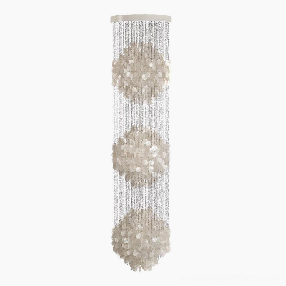 Three-layer shell pendant chandelier in modern space demonstrating maximum vertical impact and design drama