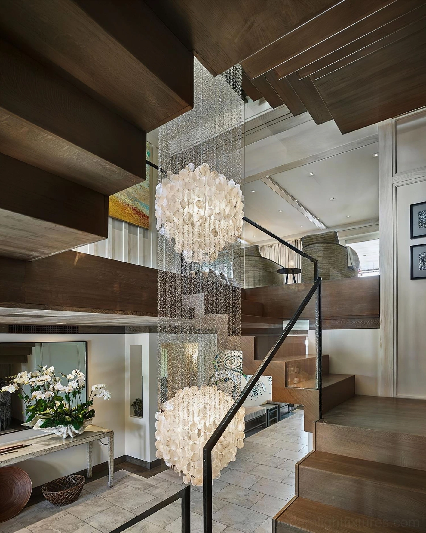 Three-layer capiz shell pendant light fixture in home showing full vertical extension and cascading effect