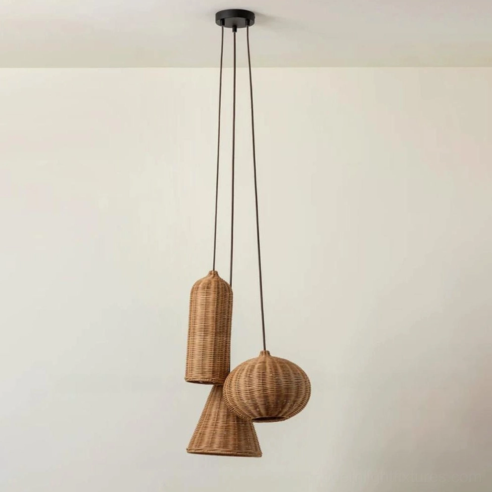 Three-light rattan pendant cluster (combination B) installed above dining table, warm ambient illumination in residential interior