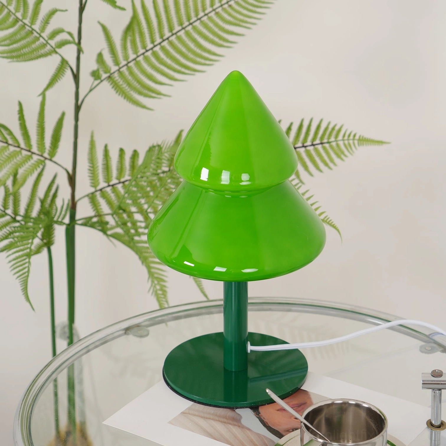 Three-quarter angle view of Christmas tree table lamp in studio photography setup