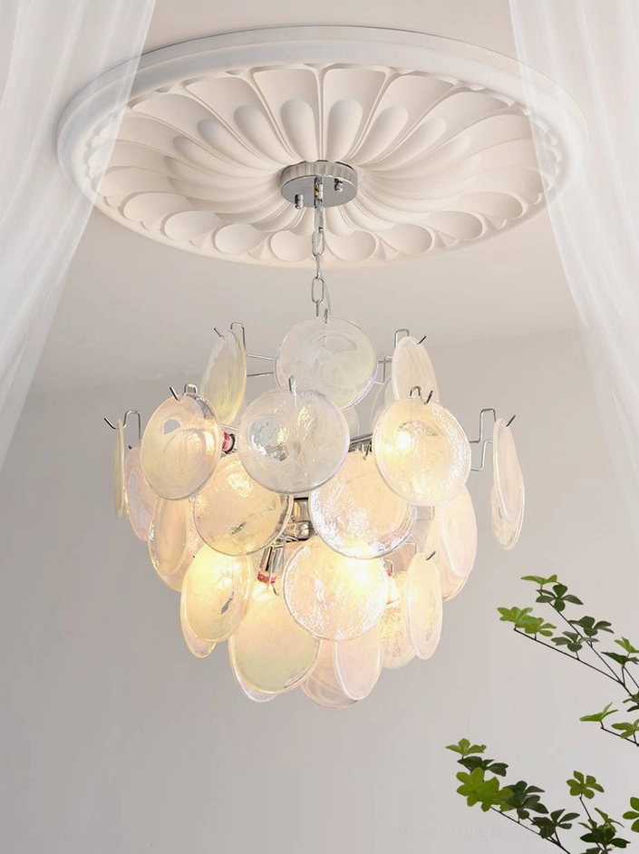 Three-quarter view of modern glass disc chandelier showing sculptural form and composition