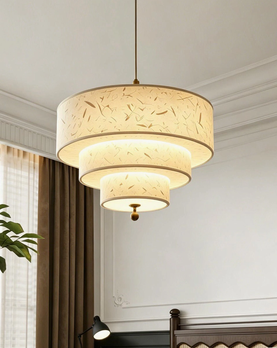 Handmade fiber paper pendant light in minimalist bedroom corner with brass hardware accents, clean neutral design