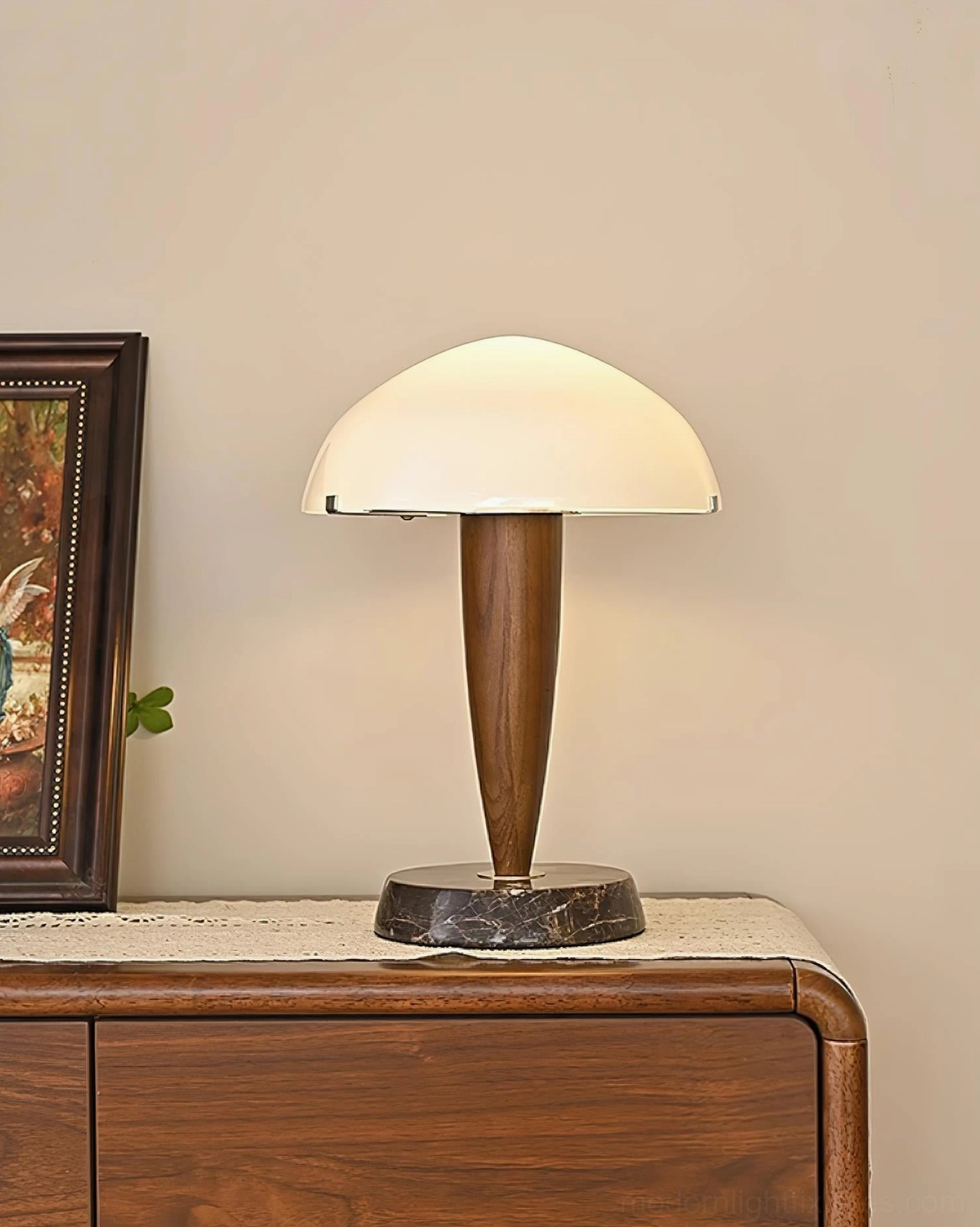 Tibby marble and walnut wood table lamp styled on dresser with minimal decor and green plant - contemporary home design