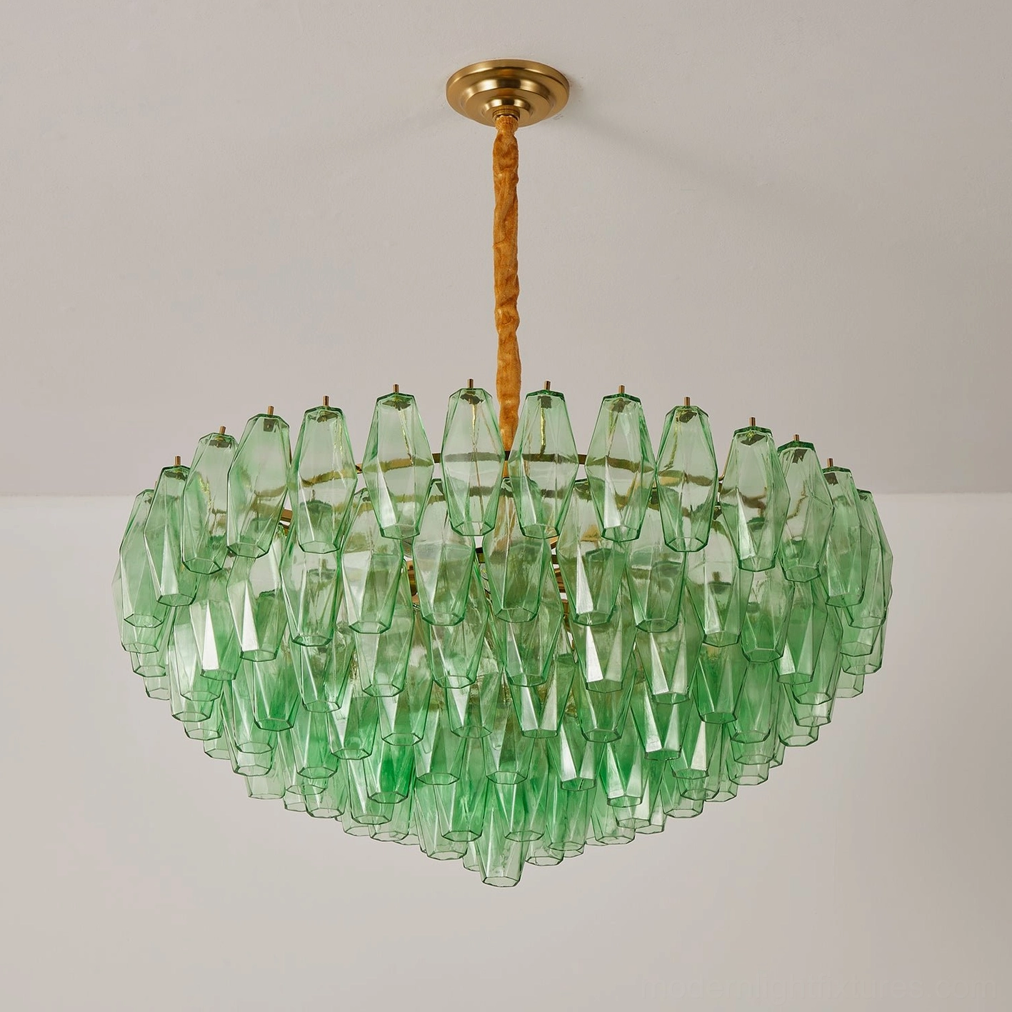 Tiered glass chandelier lighting effect showing refracted light patterns from faceted prisms