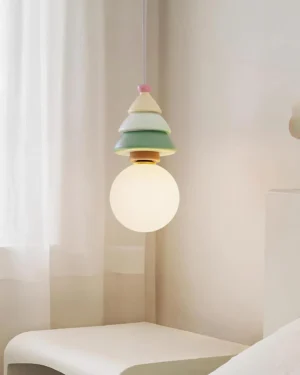 Modern sculptural pendant lamp hanging in minimalist bedroom with warm white glow illuminating interior space