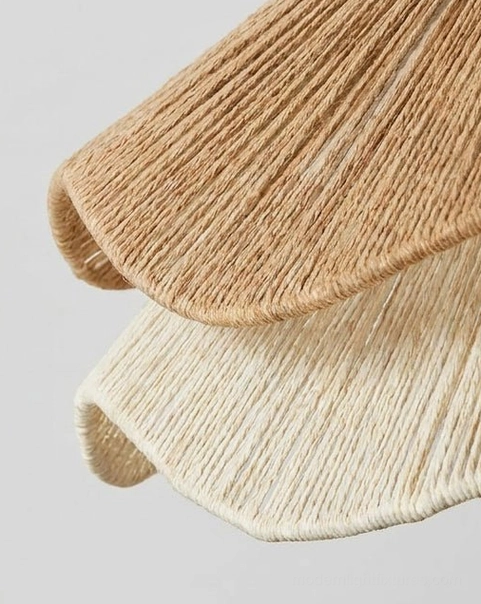 Tiered natural jute scalloped pendant light installation in contemporary coastal dining room interior