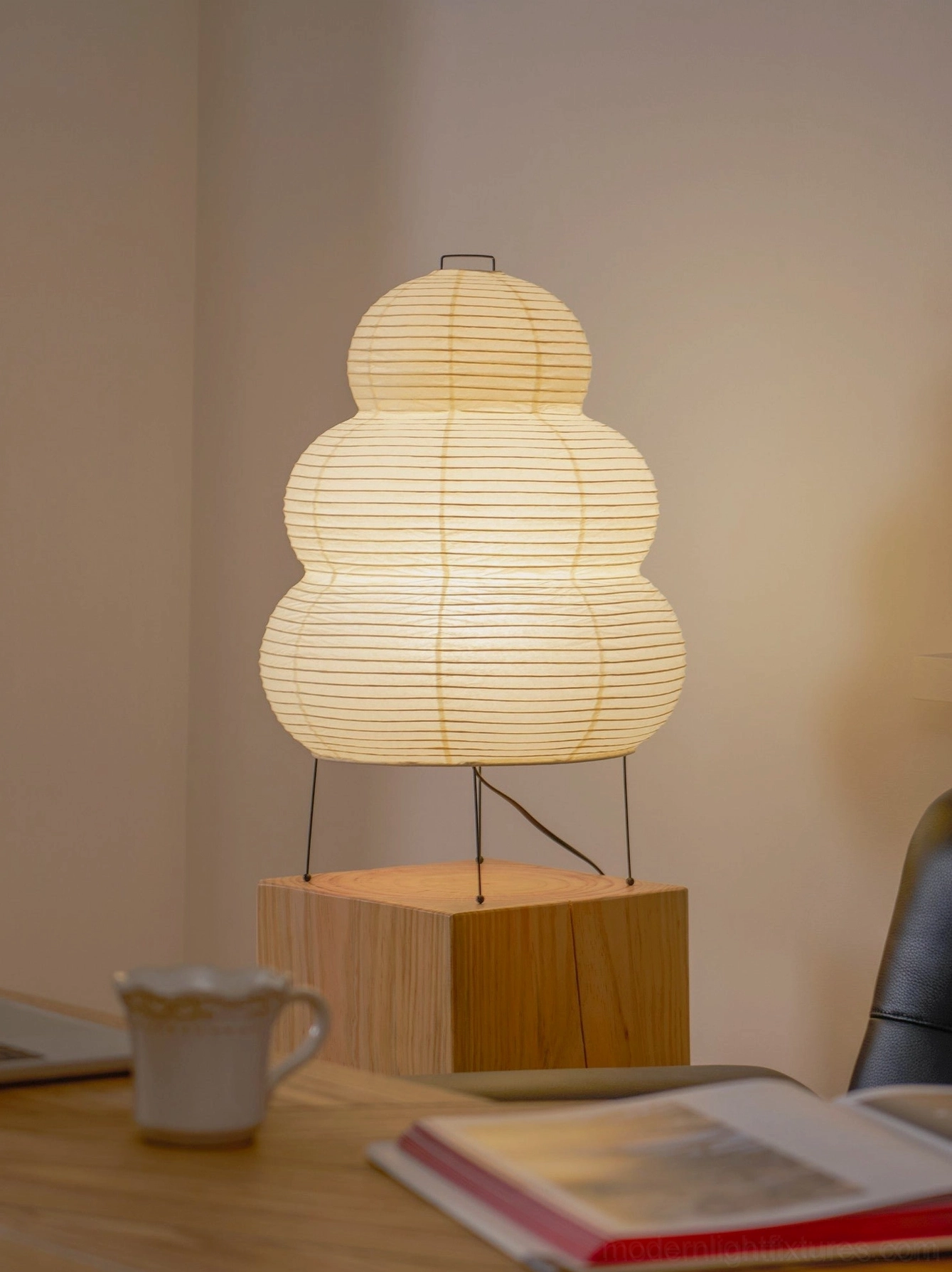 Modern tiered Shoji table lamp detail, paper shade texture and light diffusion effect