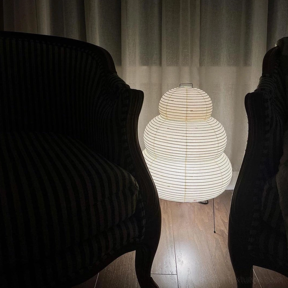 Tiered Shoji table lamp close-up, cylindrical shade with stacked paper construction