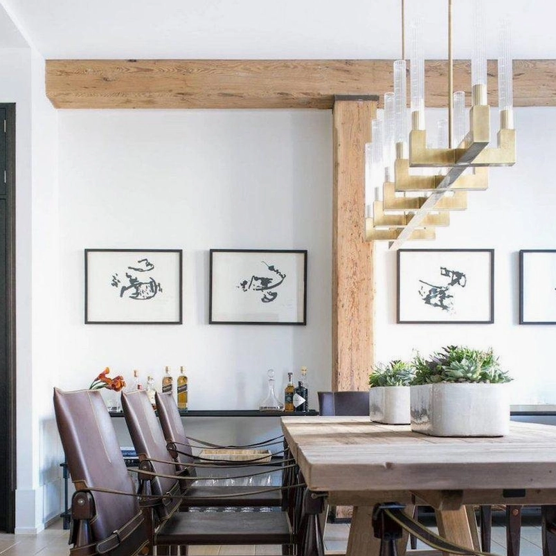 Tiered linear chandelier brass multi-level design modern farmhouse dining aesthetic