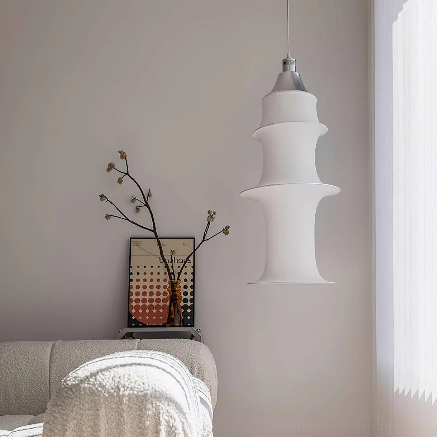Contemporary white tiered pendant lamp above kitchen island with task lighting