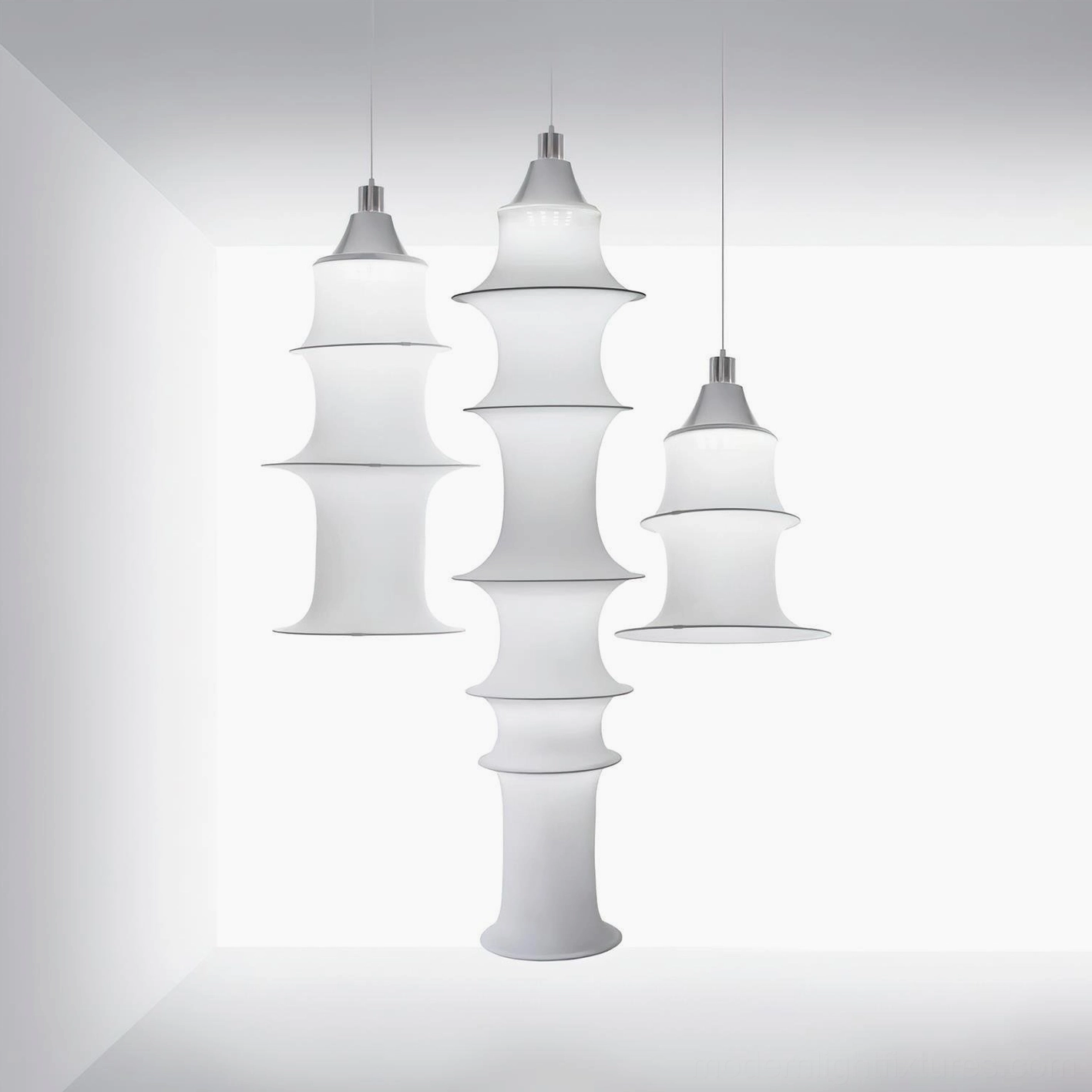 Modern tiered pendant lamp fixture showing warm ambient lighting distribution