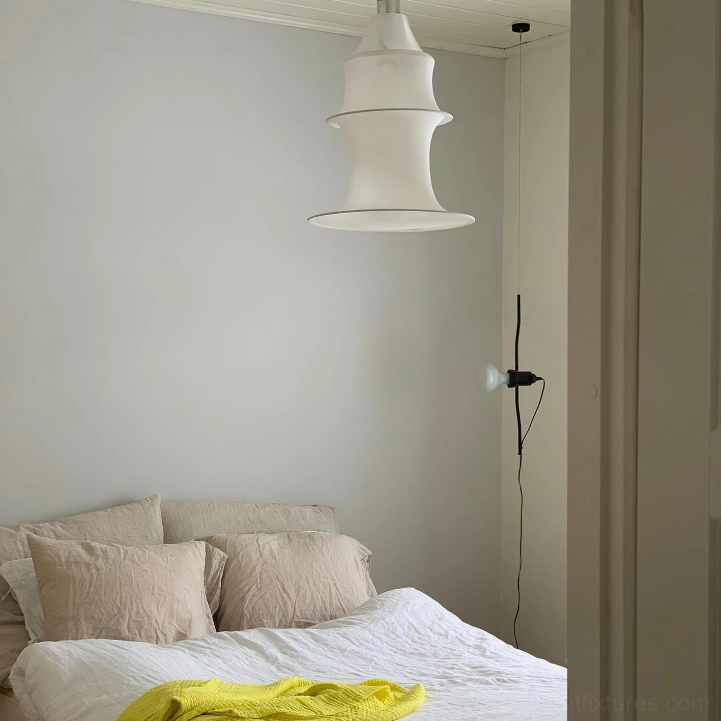 Tiered pendant light fixture showing multi-layer fabric construction and light diffusion