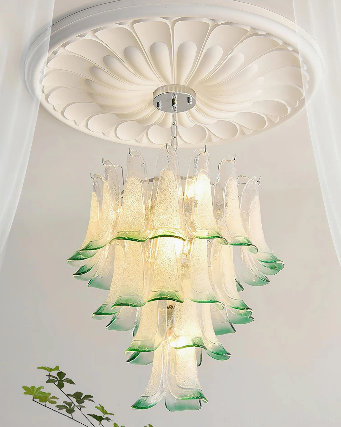 Tiered petal chandelier demonstrating how cascading glass layers create visual depth and interest