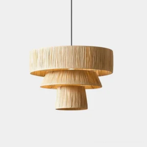 Tiered raffia pendant light with cascading three-tier woven shade in natural tan color, studio front view showcasing modern bohemian design