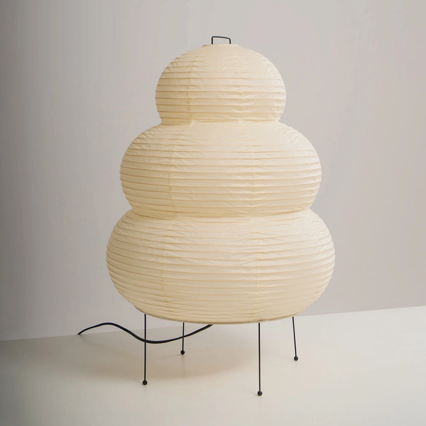 Tiered Shoji paper table lamp warm light glow, soft ambient paper shade illumination