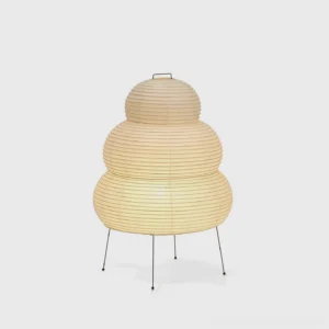 Modern tiered Shoji paper table lamp with warm light, cylindrical shade design, front-lit display