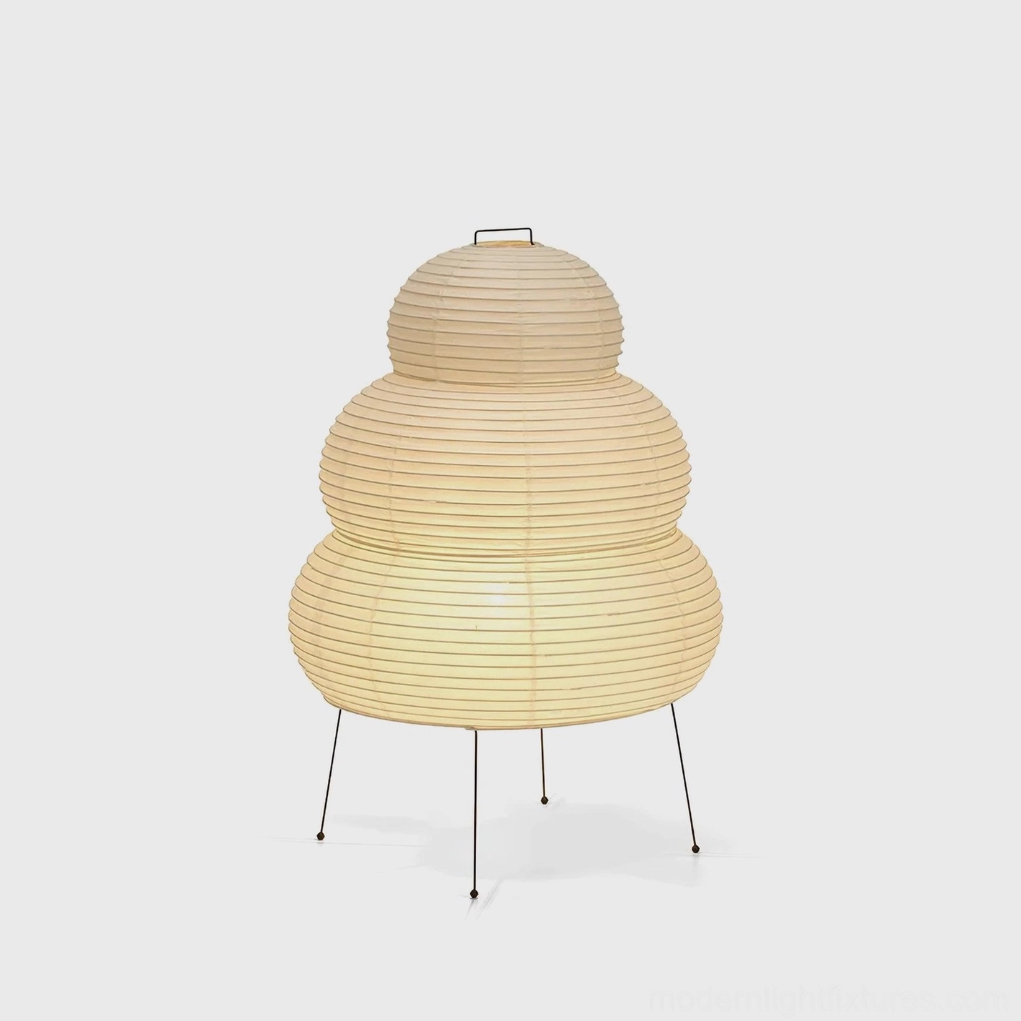 Modern tiered Shoji paper table lamp with warm light, cylindrical shade design, front-lit display