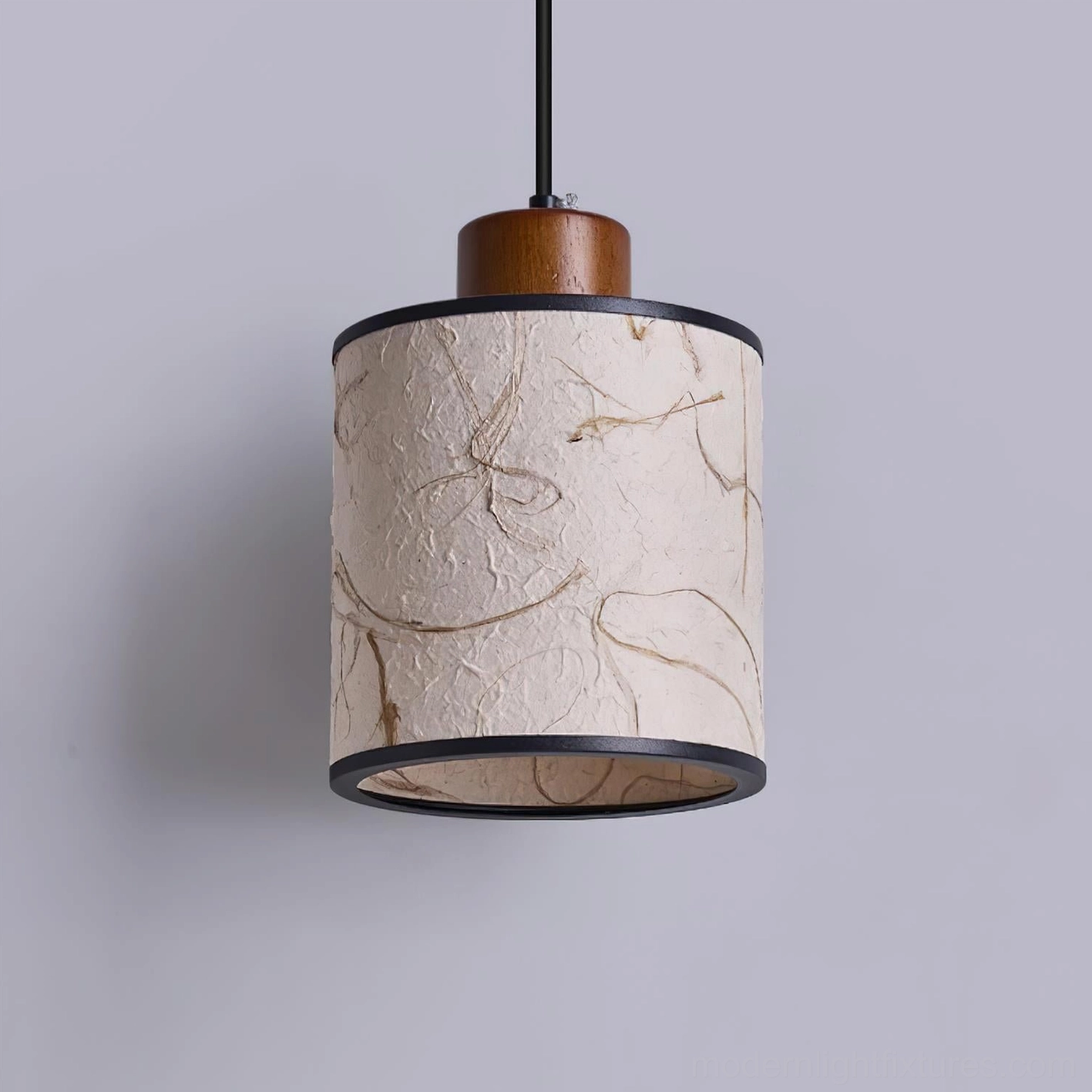 Tierra handmade pendant light with detailed view of textured rice paper shade and natural fiber patterns
