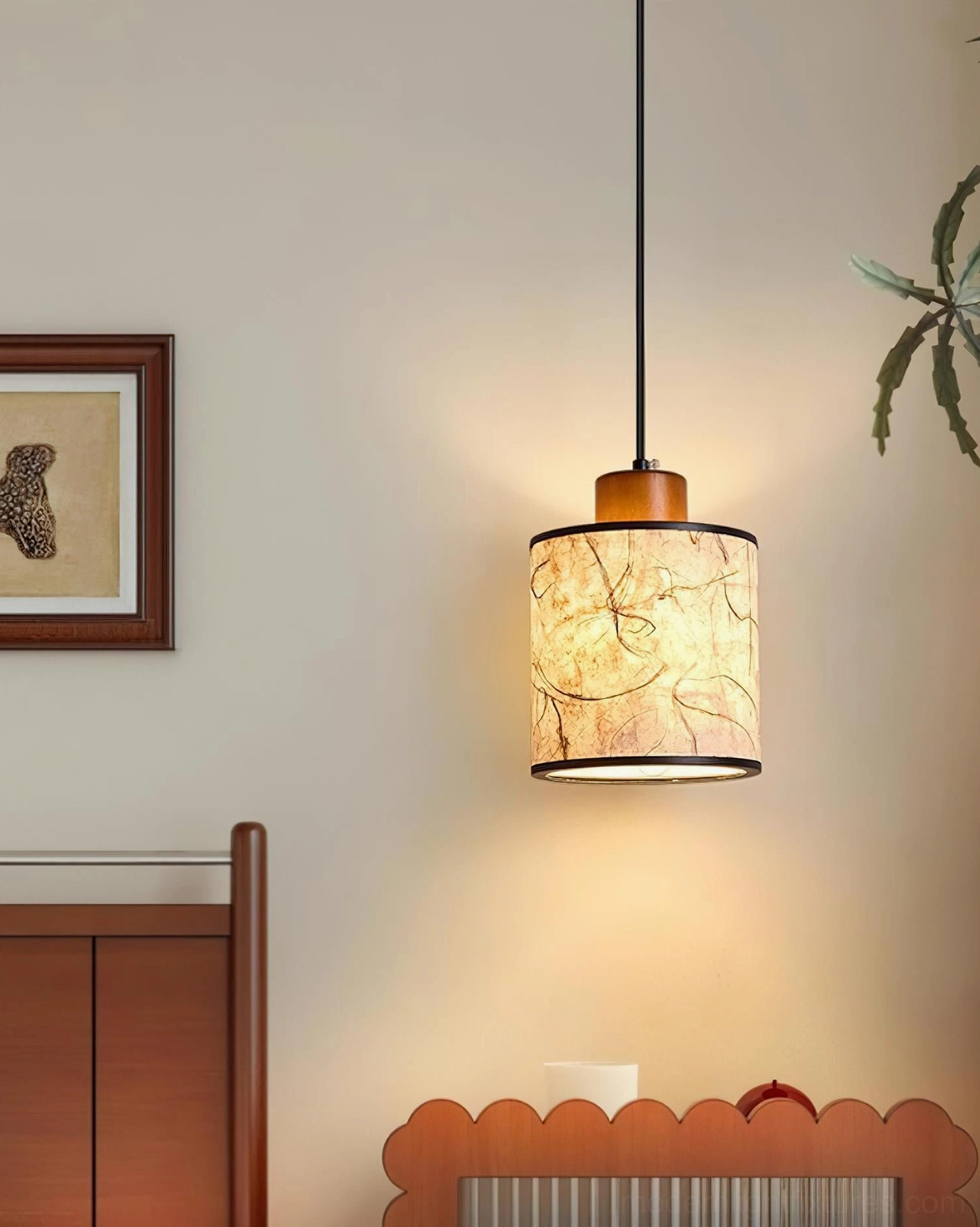 Single Tierra pendant light fixture in bedroom corner with wooden furniture and warm natural home decor