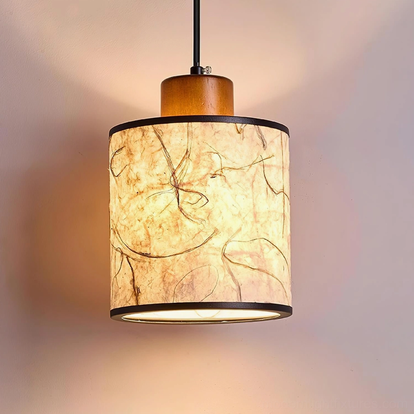 Tierra pendant light fixture detail showing metal frame connection and wooden accent cap construction