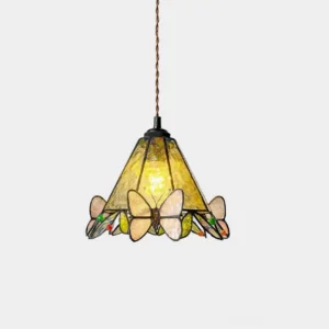 Tiffany butterfly stained glass pendant lamp with yellow glass shade and butterfly leaf ornaments, front view on white studio background