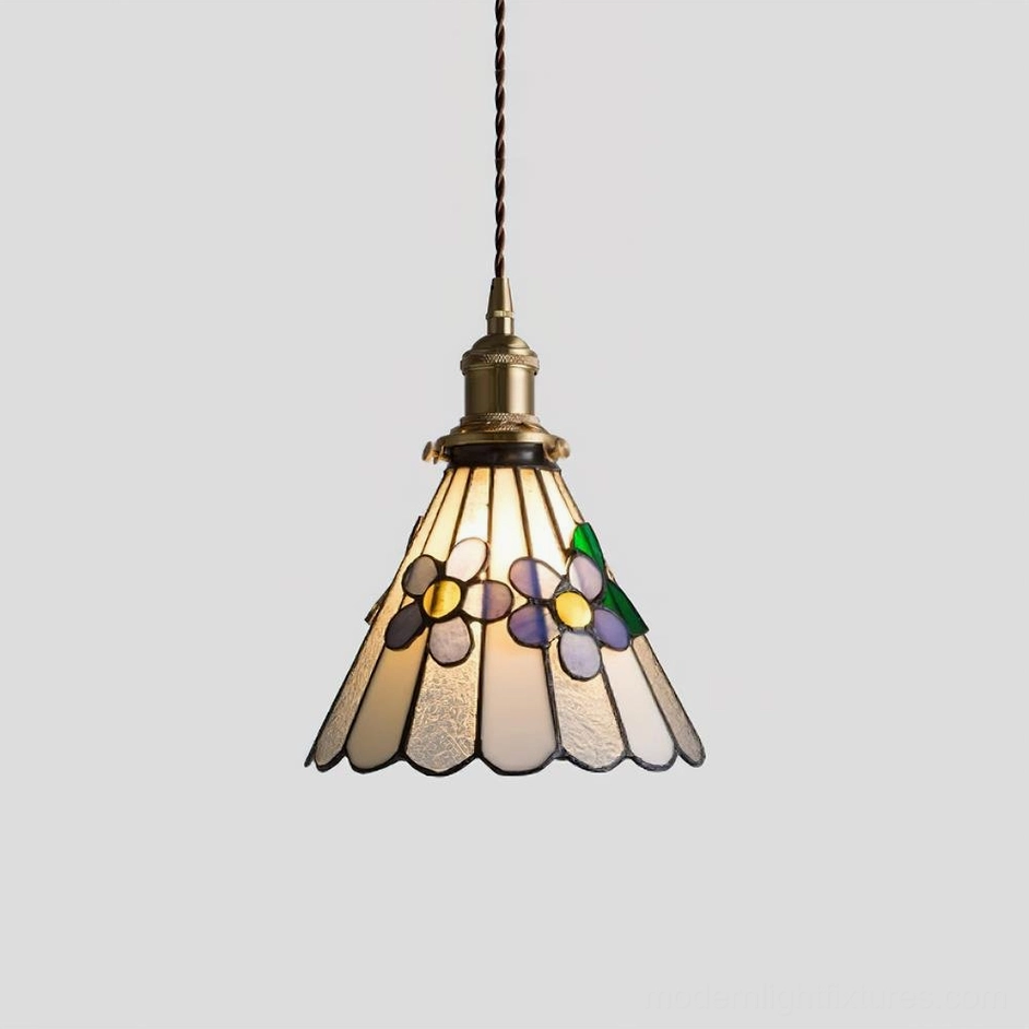 Tiffany stained glass pendant light mounted on sloped ceiling showing architectural compatibility and artistic display