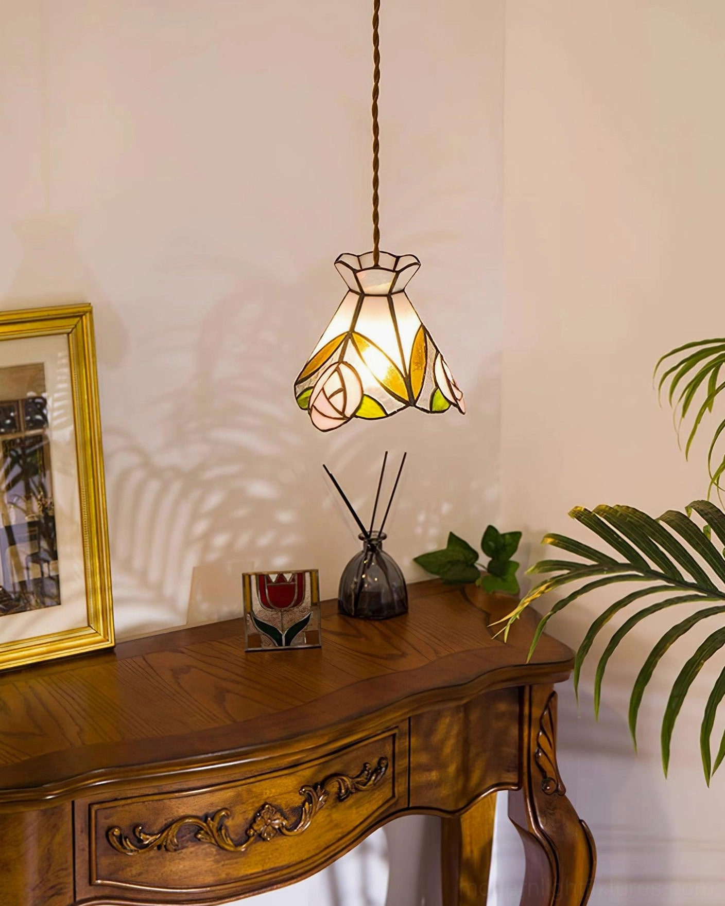 Tiffany style rose pendant light showing traditional stained glass craftsmanship and warm brass finish