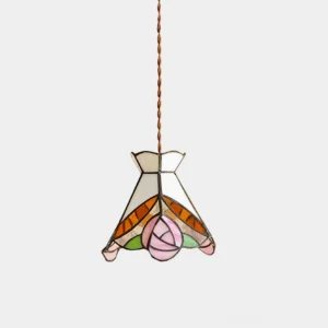 Vintage Tiffany rose stained glass pendant light with warm brass fixtures and delicate floral design, studio overhead view
