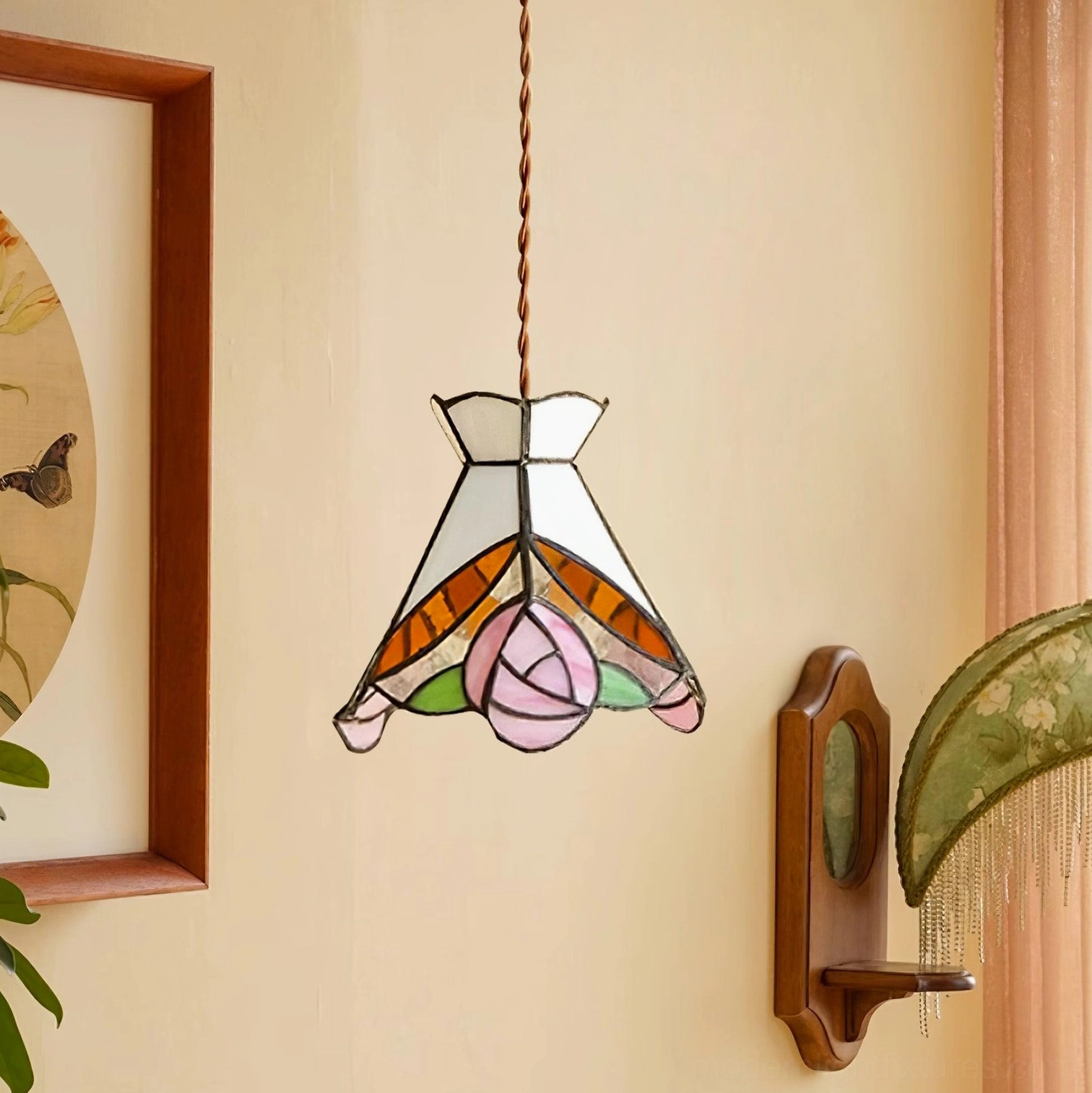 Side view of stained glass rose pendant fixture highlighting intricate brass hardware and floral glass design
