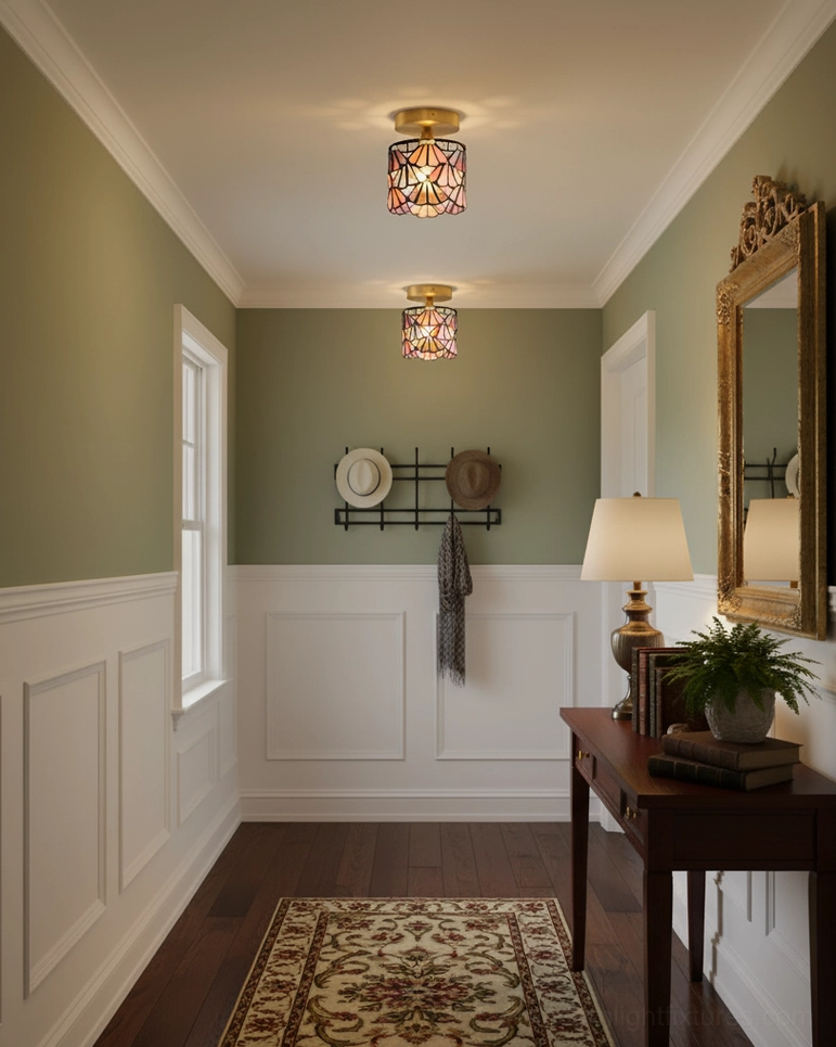 Traditional home hallway with two installed stained glass Tiffany ceiling lights and green wainscoting wall treatment