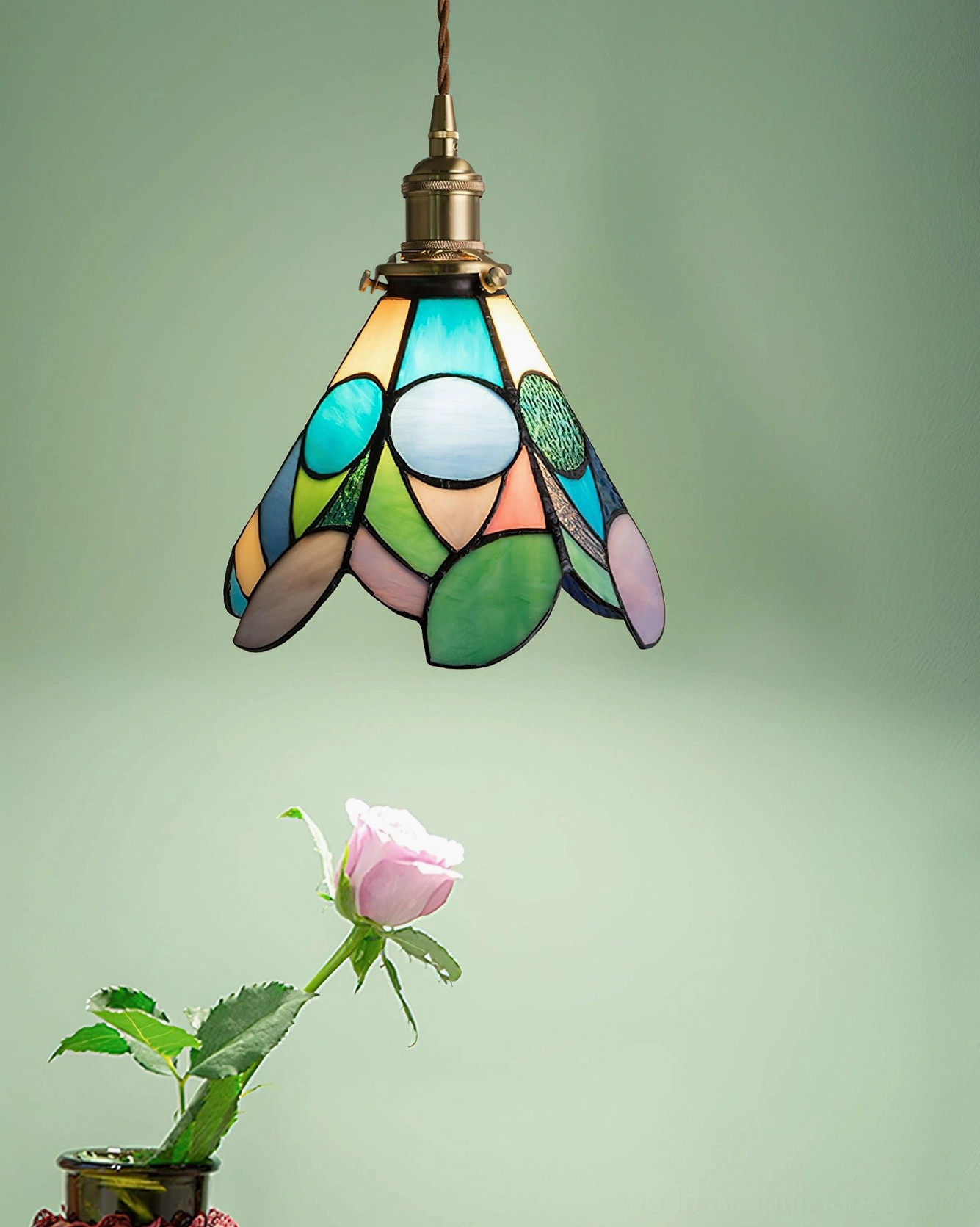 Tiffany style stained glass pendant light installed in modern transitional interior space creating artistic focal point