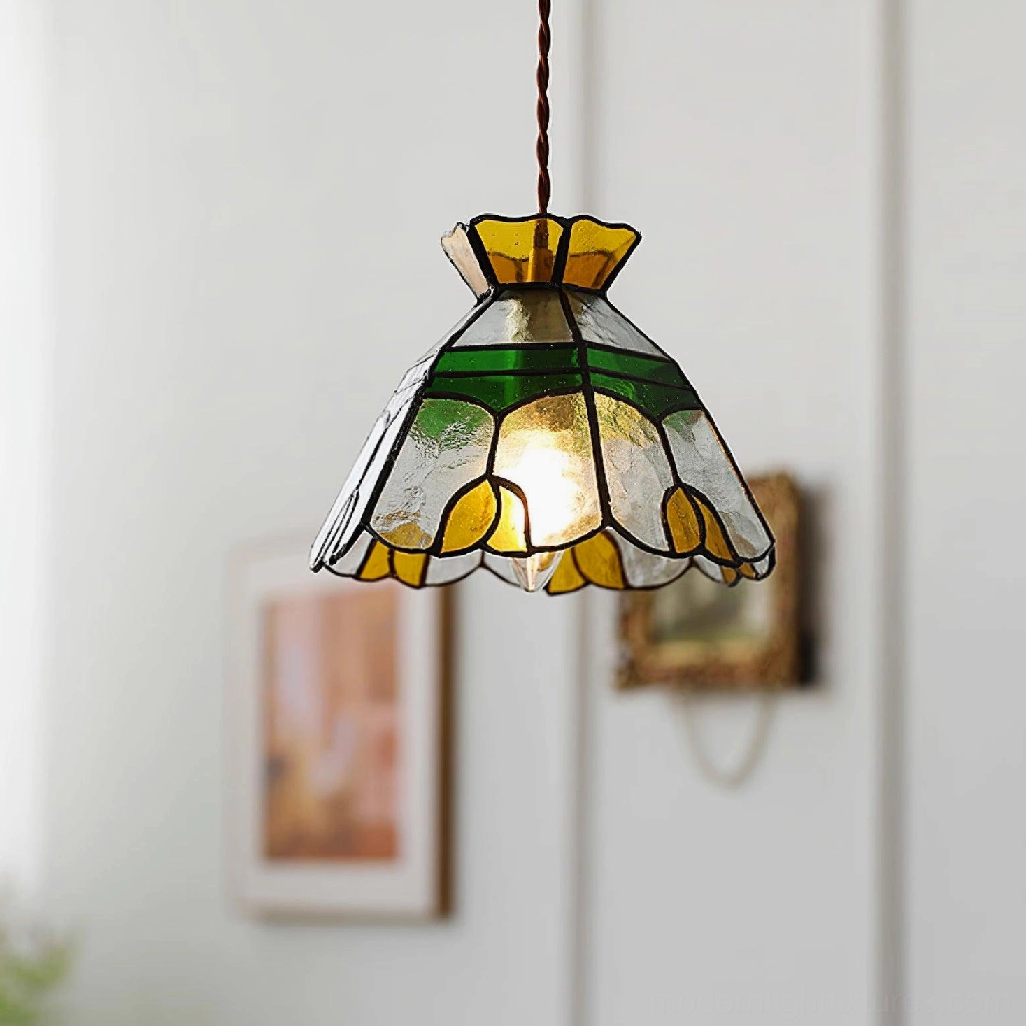 Tiffany stained glass pendant light in transitional home decor setting, blending vintage artistry with modern interior design