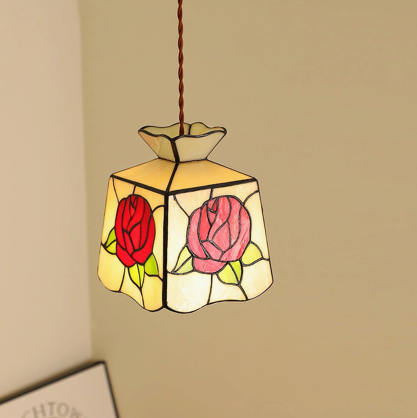 Pink and red rose stained glass Tiffany pendant light installed in modern home corner with wall decor