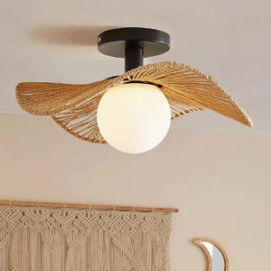 Tilda bohemian rattan ceiling light fixture installed in eclectic interior with macrame wall hanging and crescent mirror, three-quarter angle