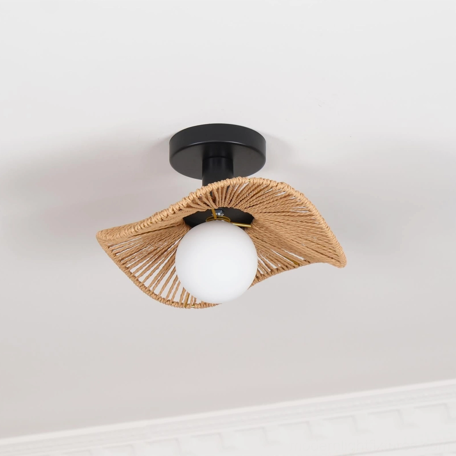 Tilda bohemian rattan ceiling light with woven leaf shade, product photography on white studio background