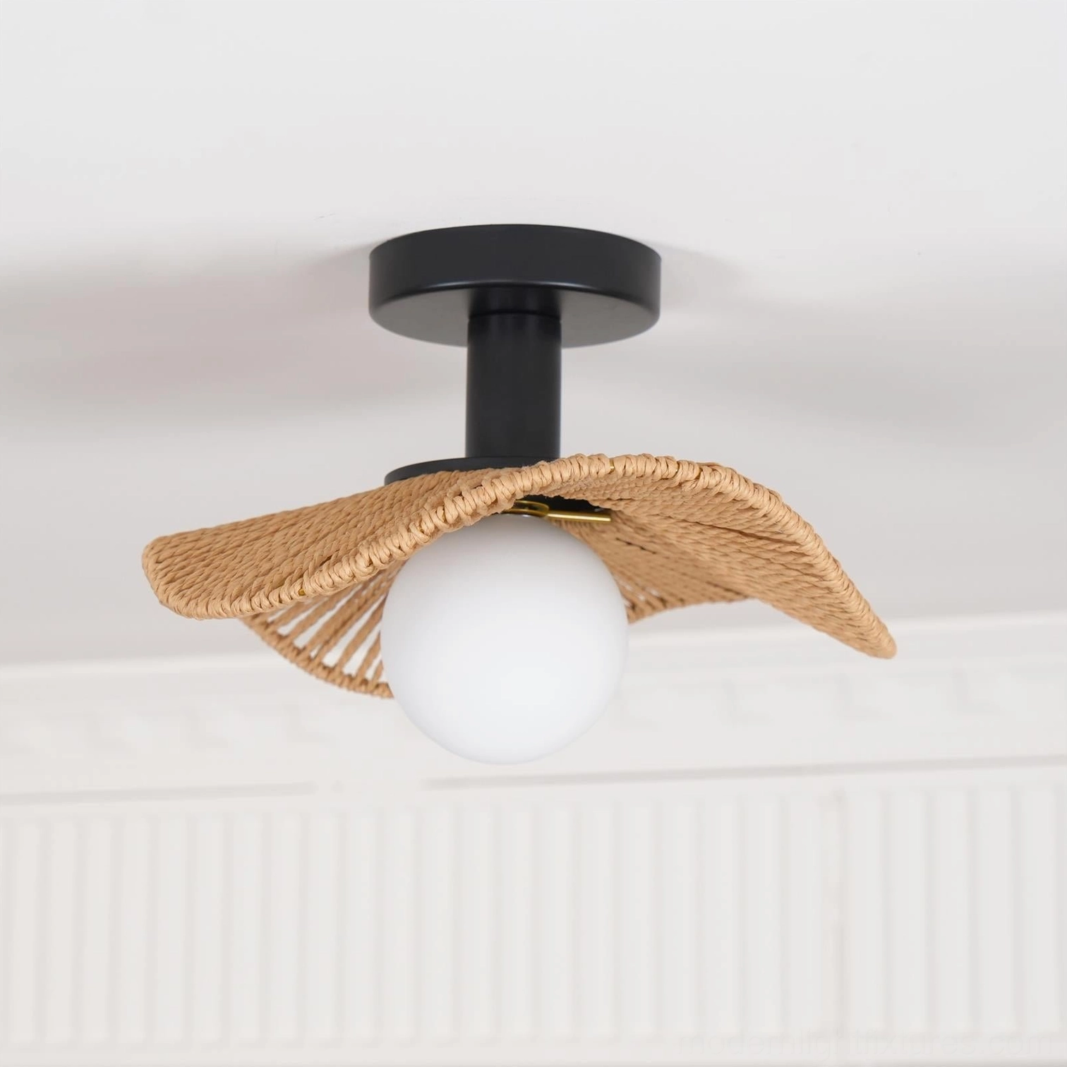 Tilda rattan ceiling light with black matte metal hardware and frosted white globe shade assembly