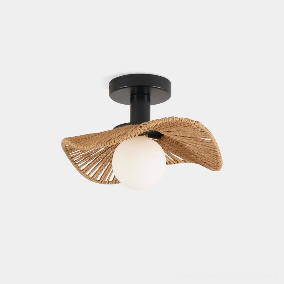 Tilda rattan ceiling light with warm glow illuminating dining or bistro-style interior space