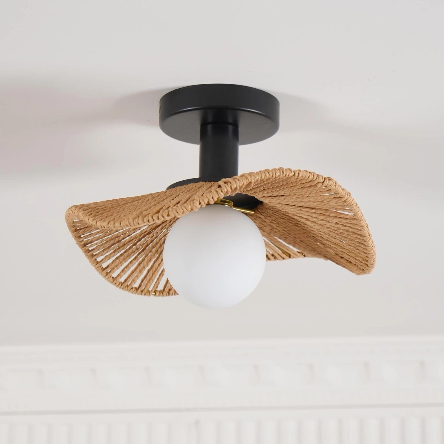 Tilda rattan ceiling light in light brown and black color options, showing finish variations