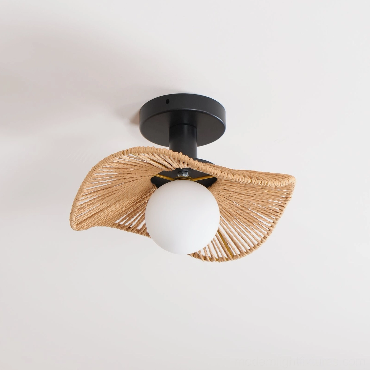 Tilda rattan ceiling light showcasing natural material craftsmanship and frosted glass diffuser detail