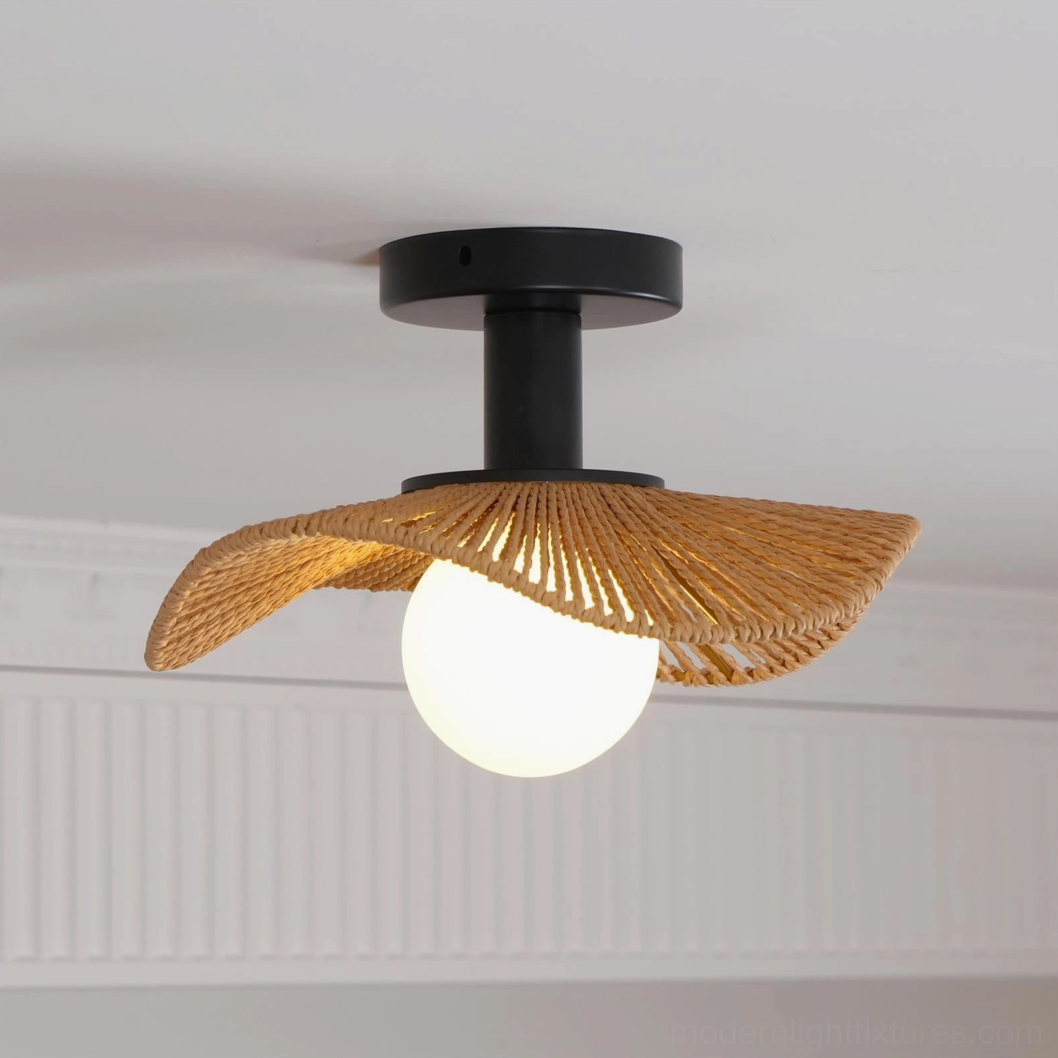 Tilda rattan ceiling light installed in mid-century modern interior with vintage furniture and retro styling