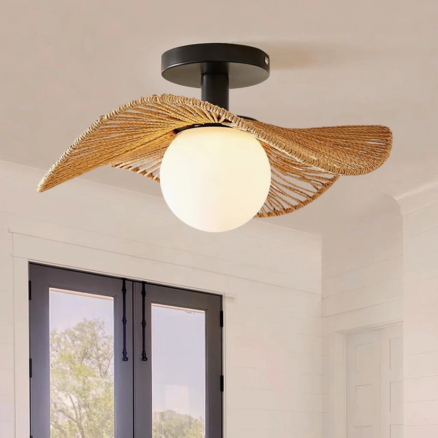 Tilda woven rattan ceiling light close-up of leaf-pattern shade weaving and frosted glass diffuser, detail view