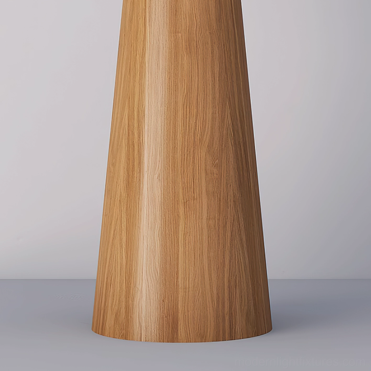 Contemporary tapered wooden floor lamp with angled shade in minimalist interior setting