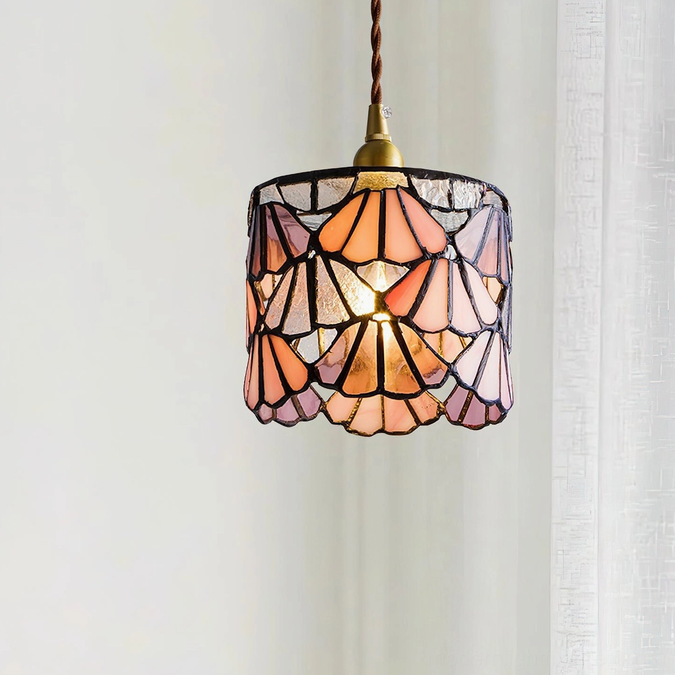Tina pink stained glass pendant light with brass fixtures and lead line construction, front view