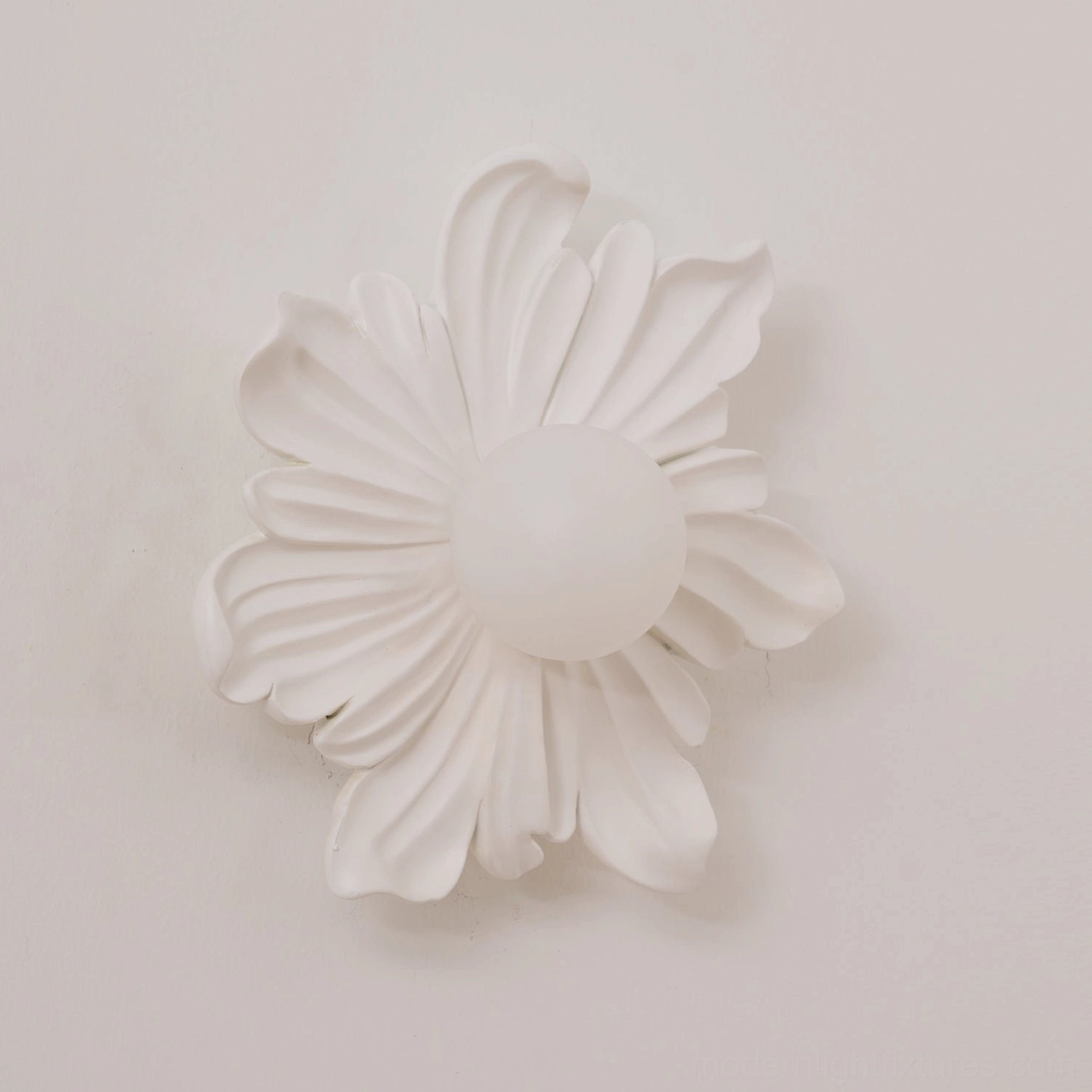 Tina botanical wall sconce above bathroom vanity with vanity mirror, coordinated dual-fixture lighting setup