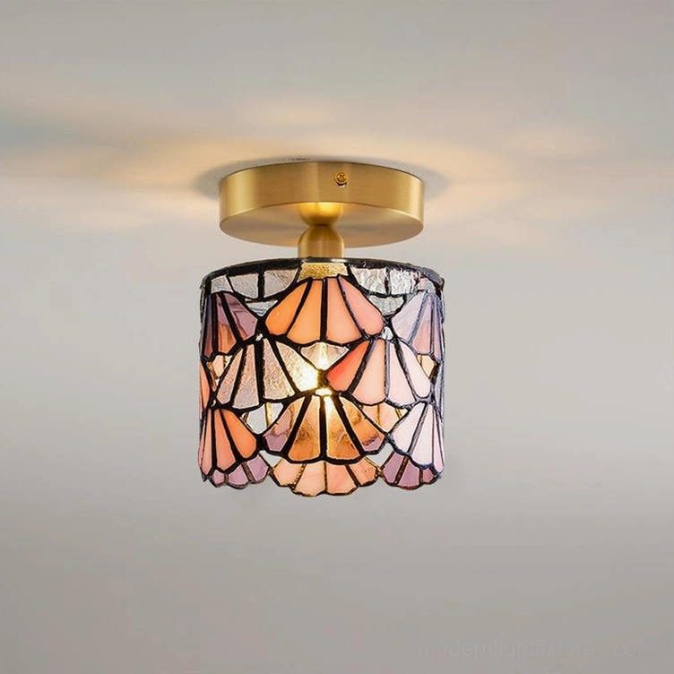 Tiffany style semi-flush ceiling light with blue stained glass shade, detailed lead-line construction and brass finish