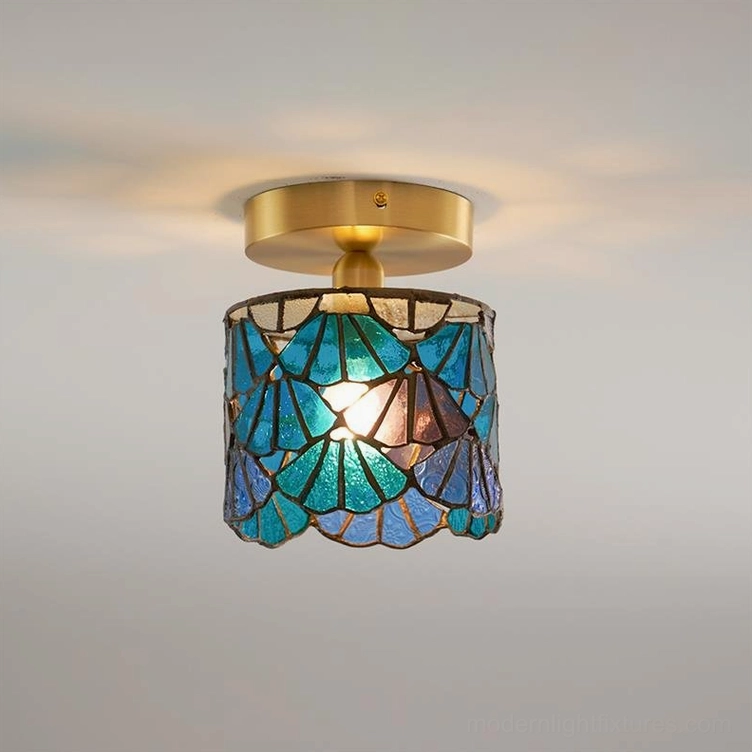 Tina Tiffany ceiling light fixture with teal blue stained glass shade and warm brass canopy, studio product shot