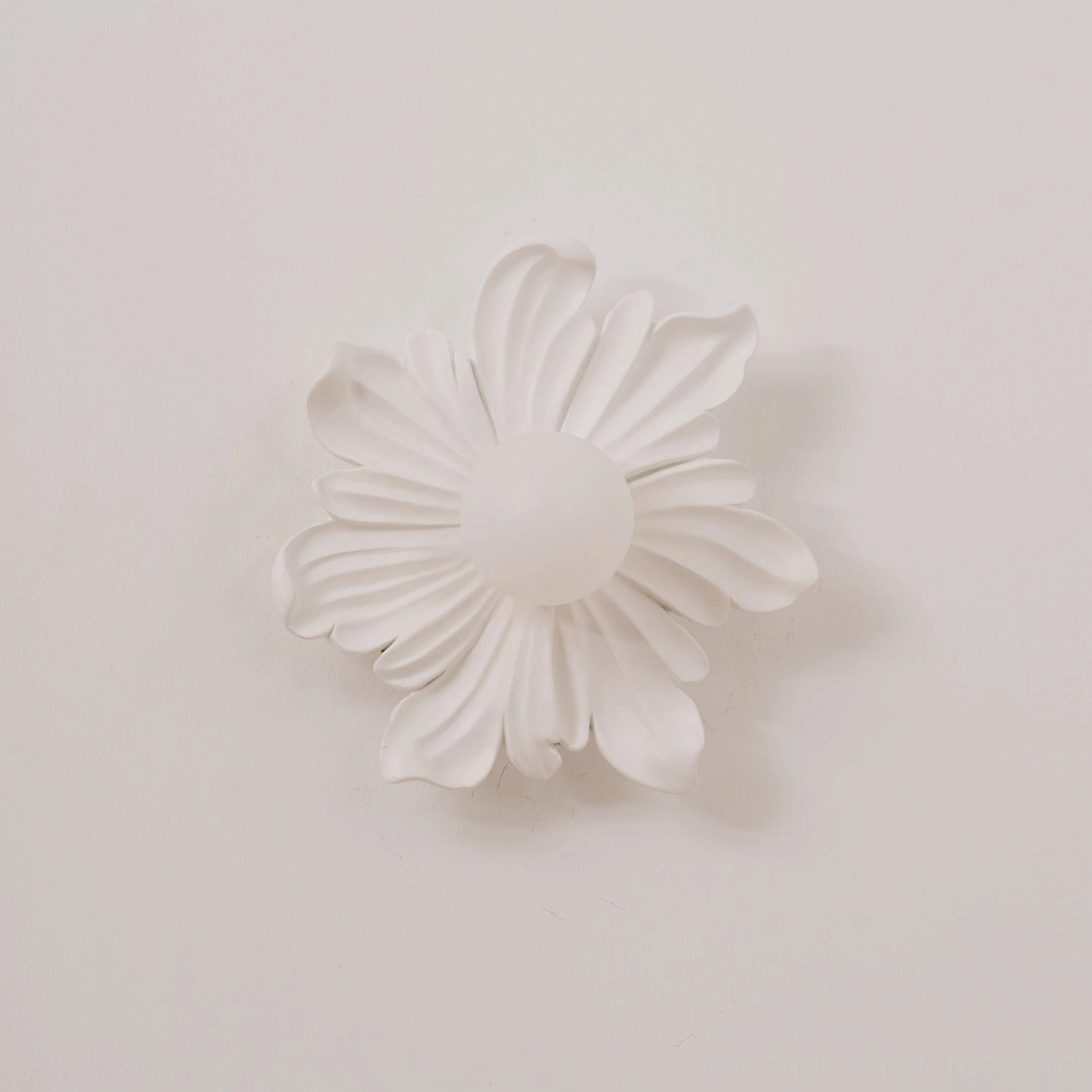 Tina botanical wall sconce in minimalist white interior, organic petal form with clean contemporary design